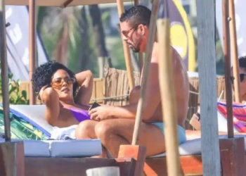Cauã e Bella surgem juntos na praia gravando 'Vale Tudo' após polêmica nos bastidores